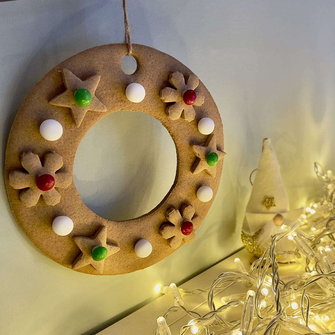 An elegant gingerbread wreath made with one of our gluten-free gingerbread wreath kits.